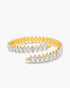 Gold bangle with clear gemstones on a white background